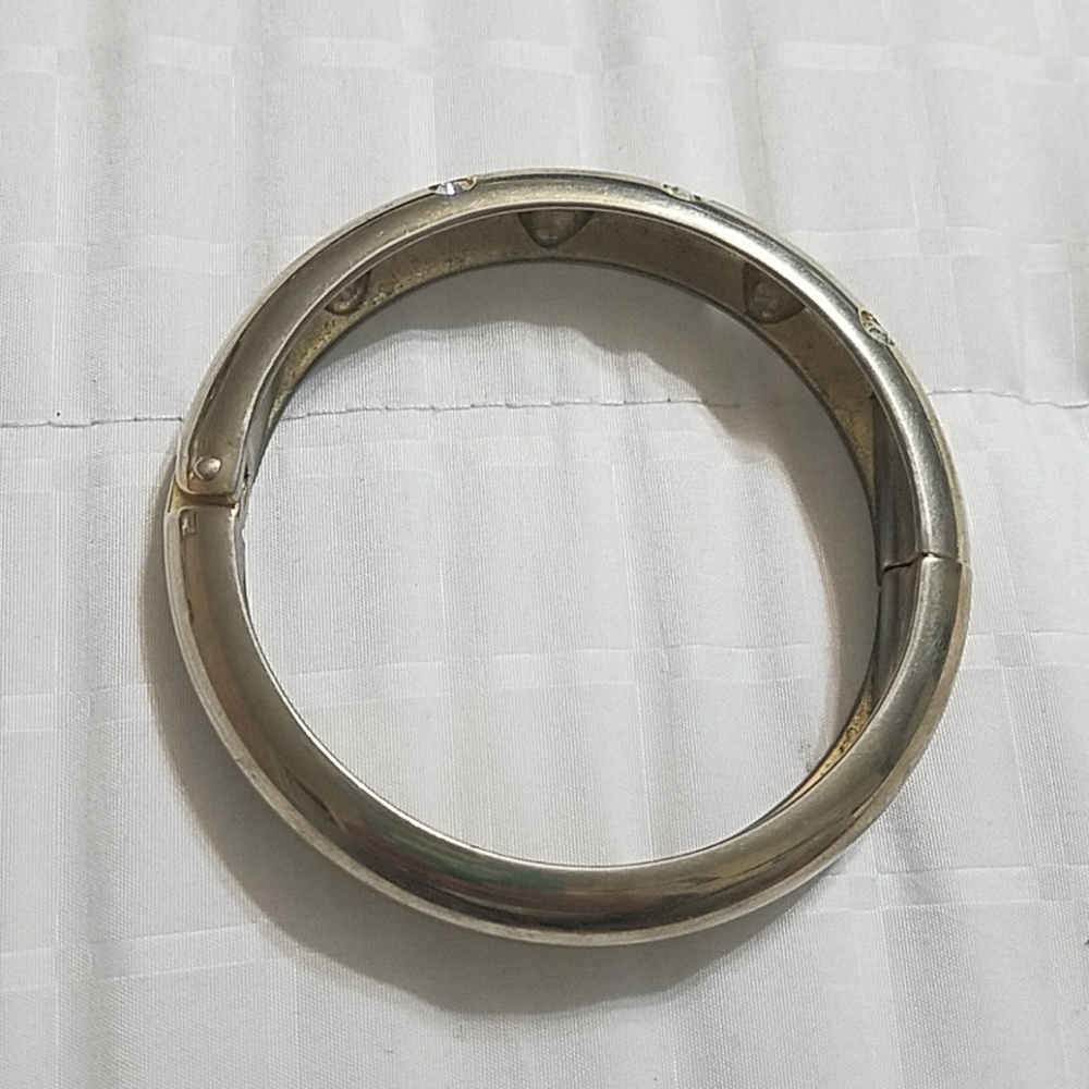 Bulky silver in color bangle